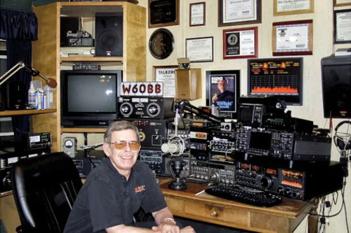 Art Bell at his ham radio desk, callsign W6OBB